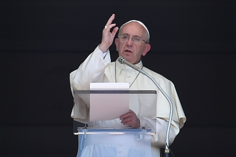 Pope Francis delivers his Sunday Angelus prayer from the window of the apostolic palace overlooking St.Peter's square on August 30, 2015 at the Vatican. AFP PHOTO / ALBERTO PIZZOLI